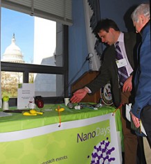 Tim Miller from the Museum of Science in Boston shows off NISE Net activities in DC with the Capitol in the background.
